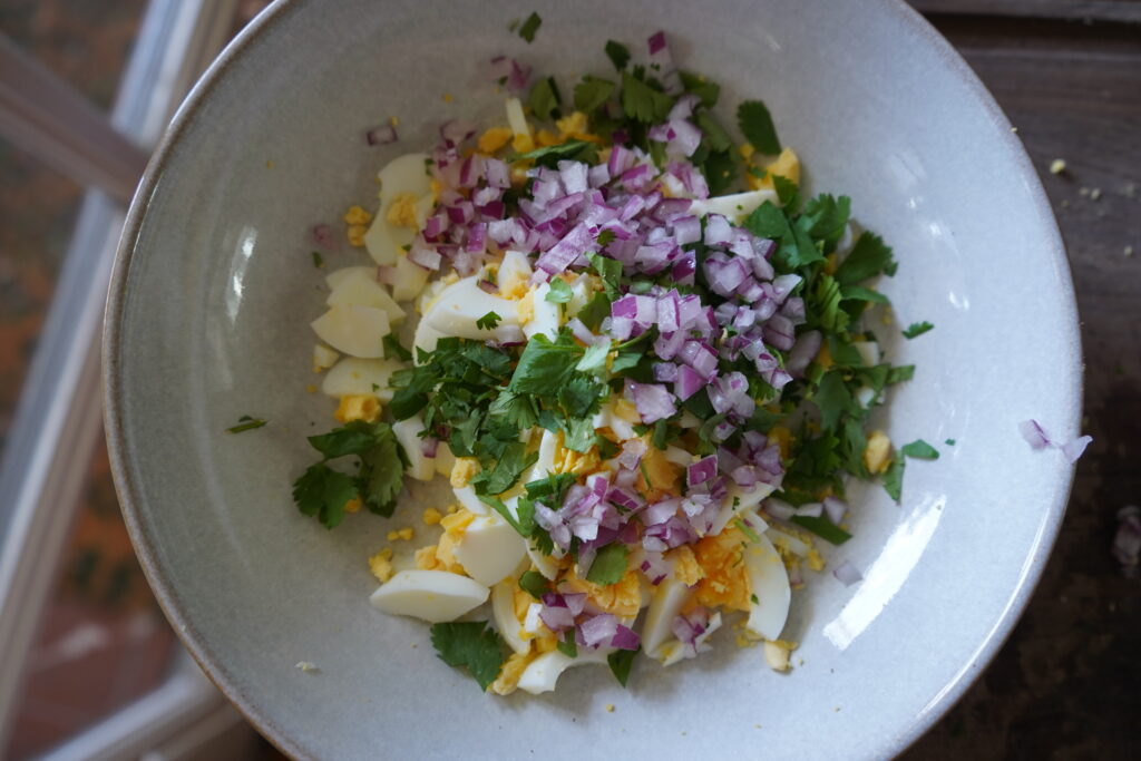 Added red onion to the egg salad bowl