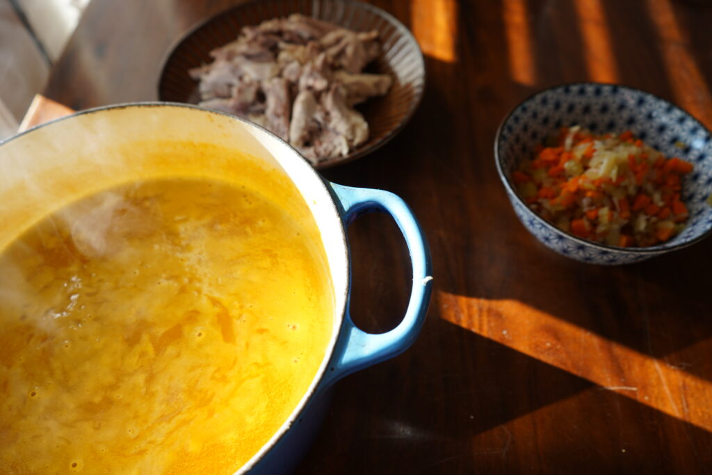 sunlight hitting a pot of yellow soup