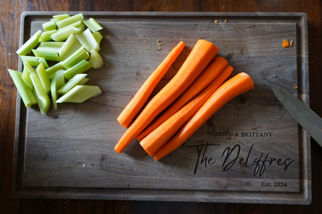 Carrots that are peeled and ready to be chopped for the recipe.