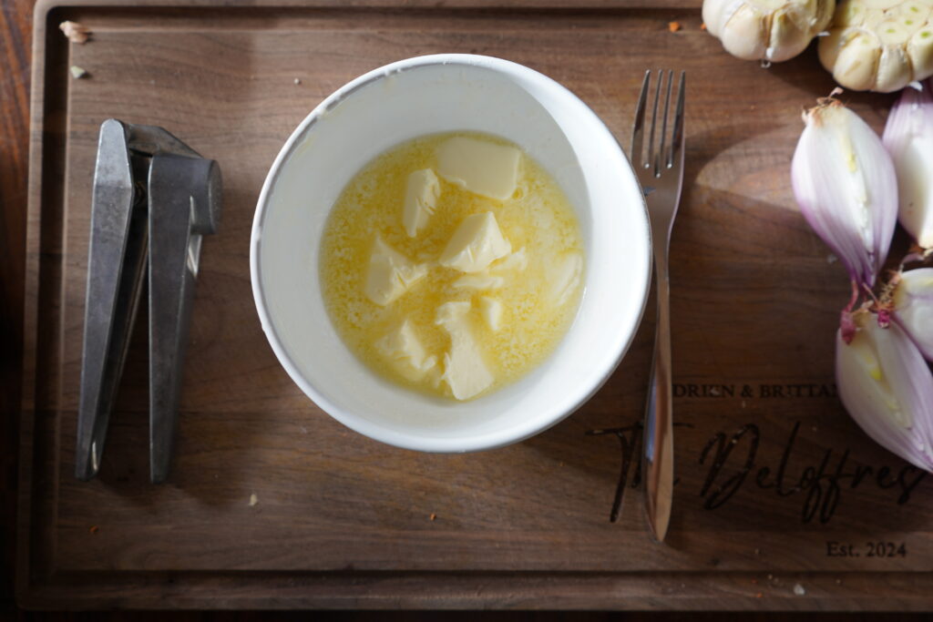 Melted butter to make garlic herb butter.