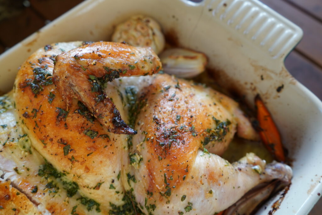 Chicken thigh and wing, baked with golden crispy skin.