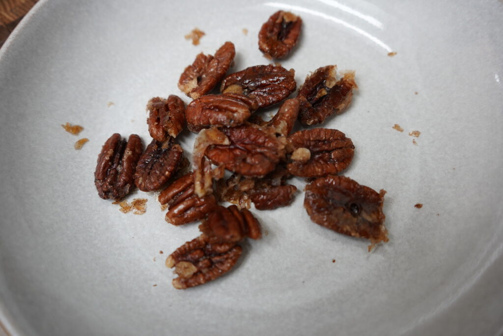 Candied pecans in a bowl.