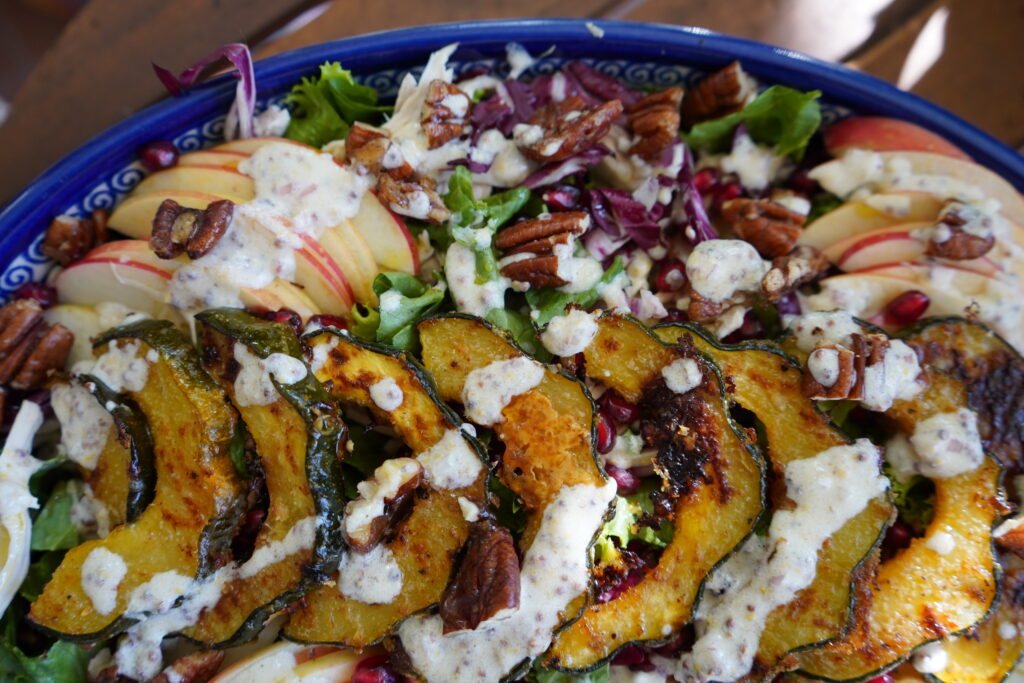 A salad drizzled with Greek yogurt dressing.