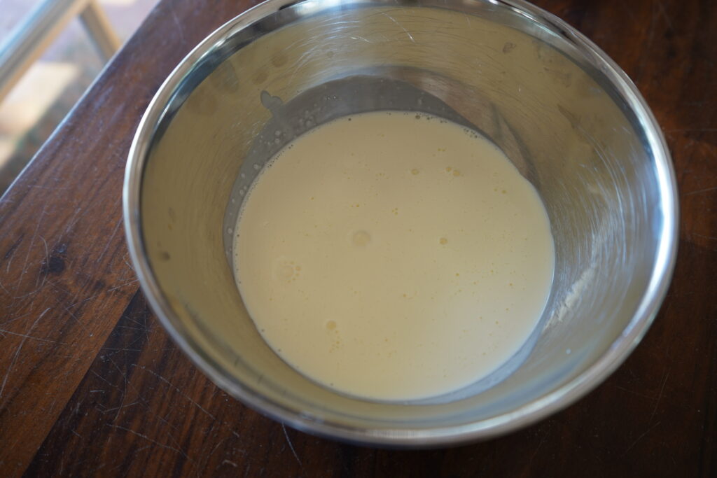 a bowl of heavy cream on a table