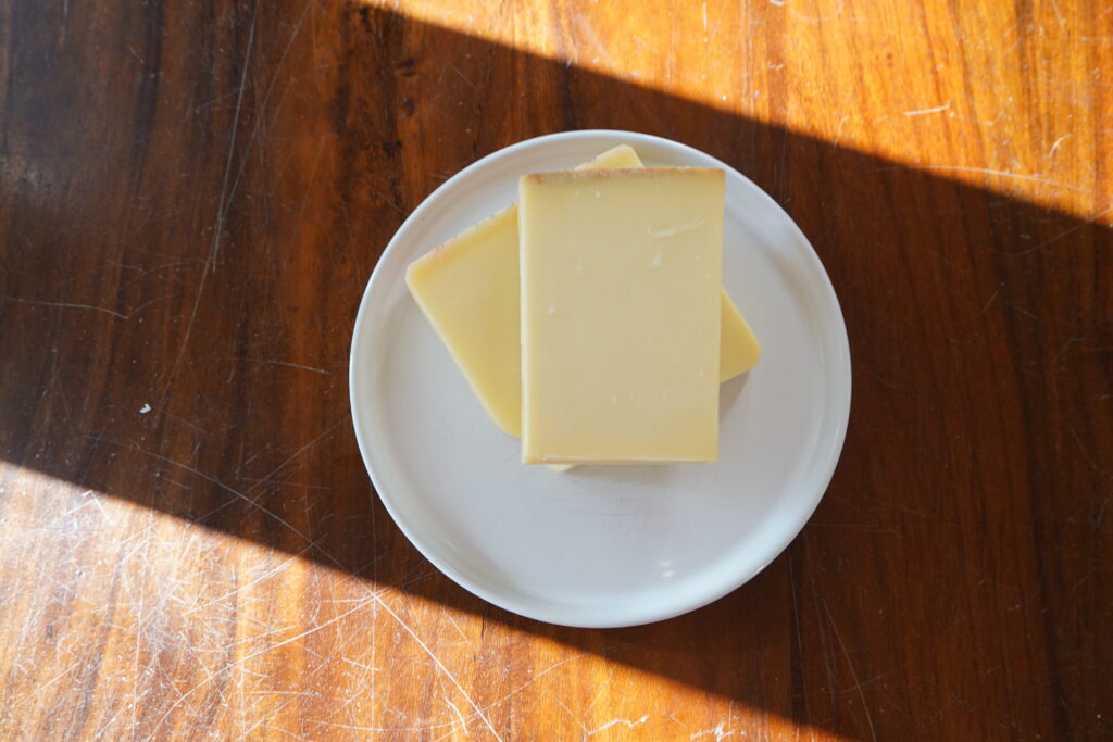 A plate of cheese on a table