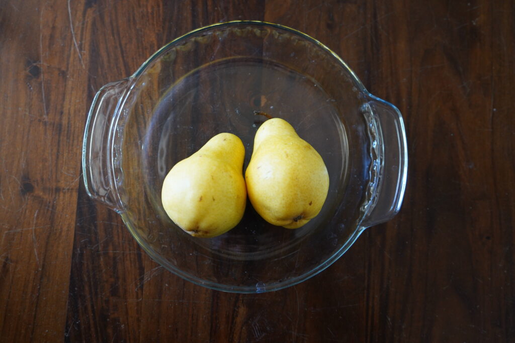 two pears in a round pie dish