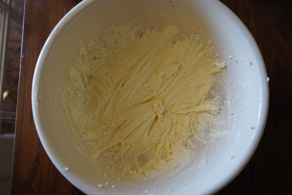 A paste in a bowl made out of sugar, butter and eggs