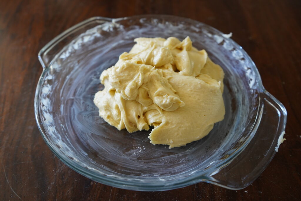 A pie dish with a blob of dough