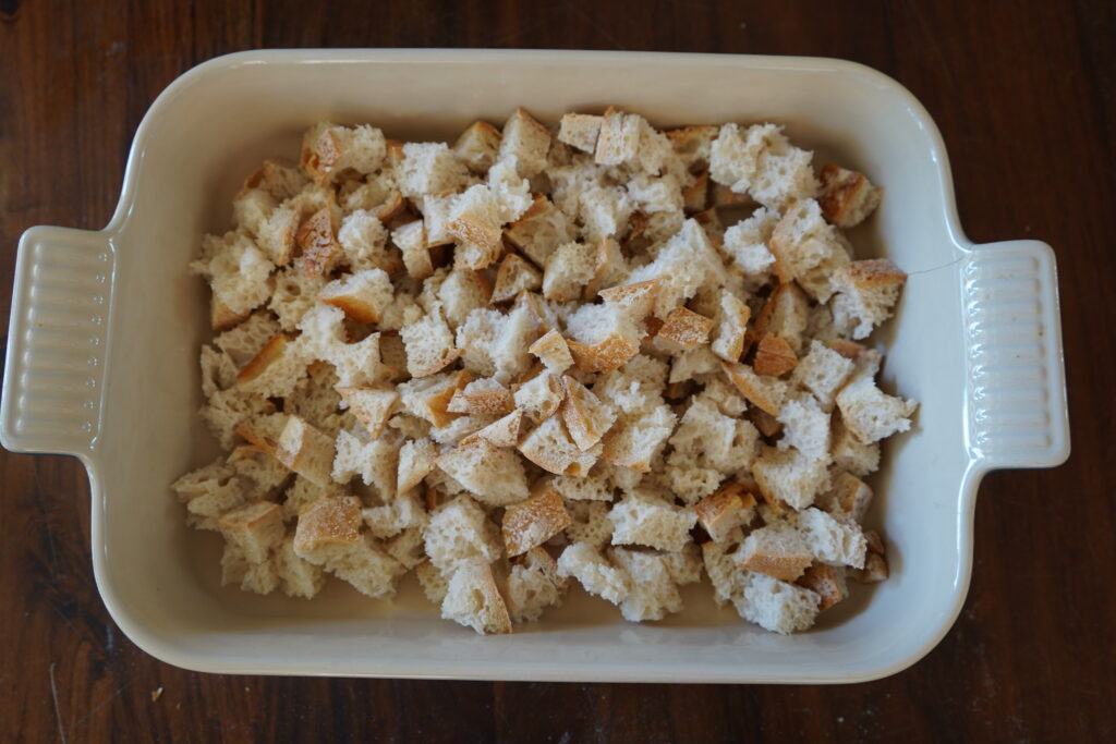 cubed sourdough in a deep baking dish