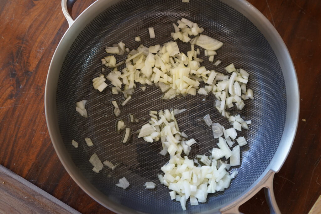 chopped onions in a hot pan of butter and olive oil