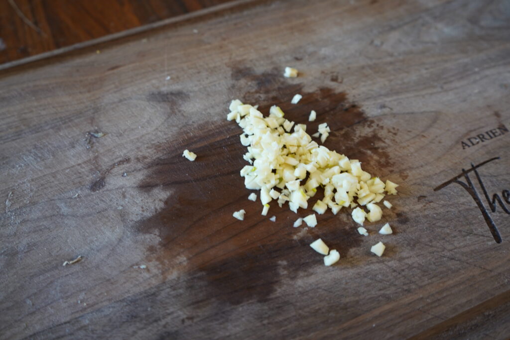 minced garlic on a cutting board