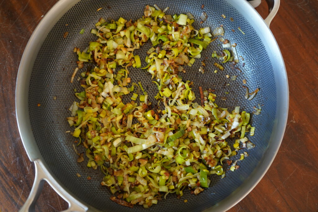 sauteed onion and leeks in a pan