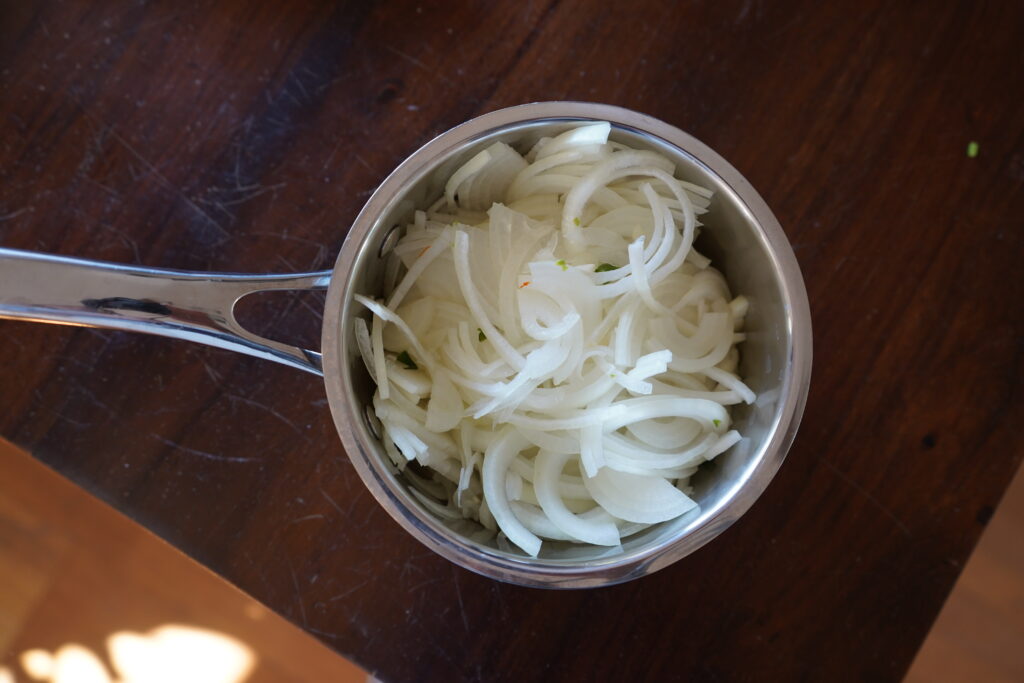 thinly slice onions in a small sauce pan