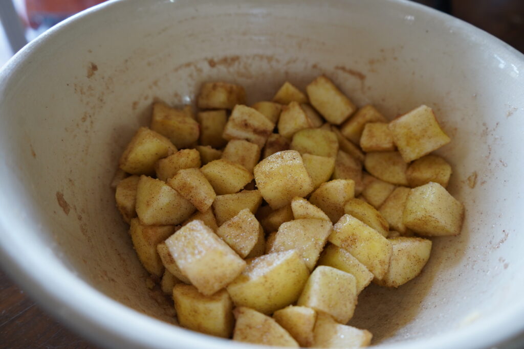 a bowl of cinnamon sugar apples