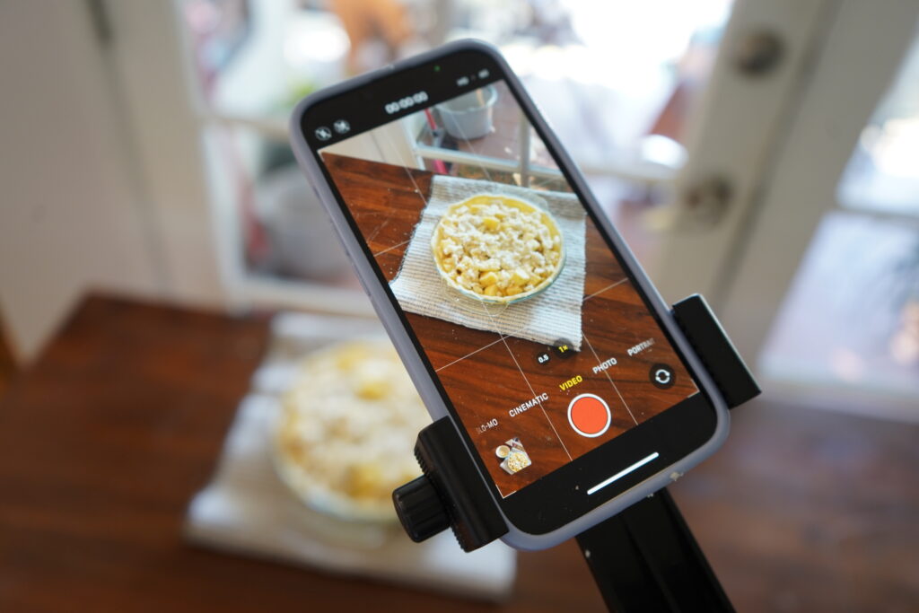 an iPhone taking a picture of a pie