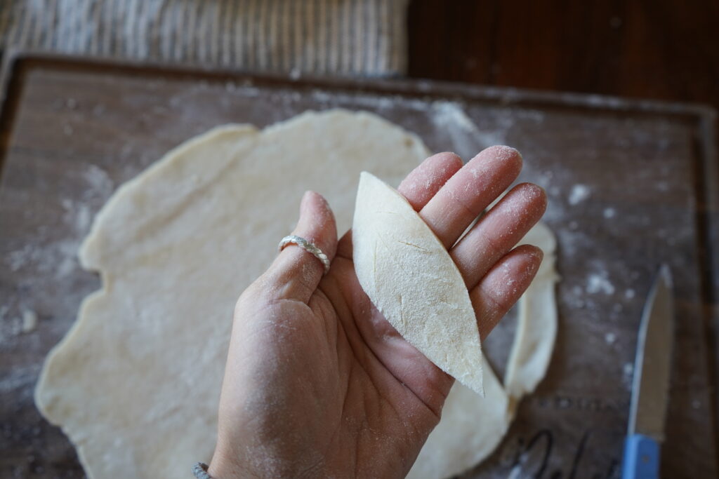 pie crust being cut into leaves