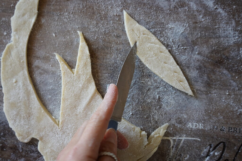 pie crust being cut into shapes