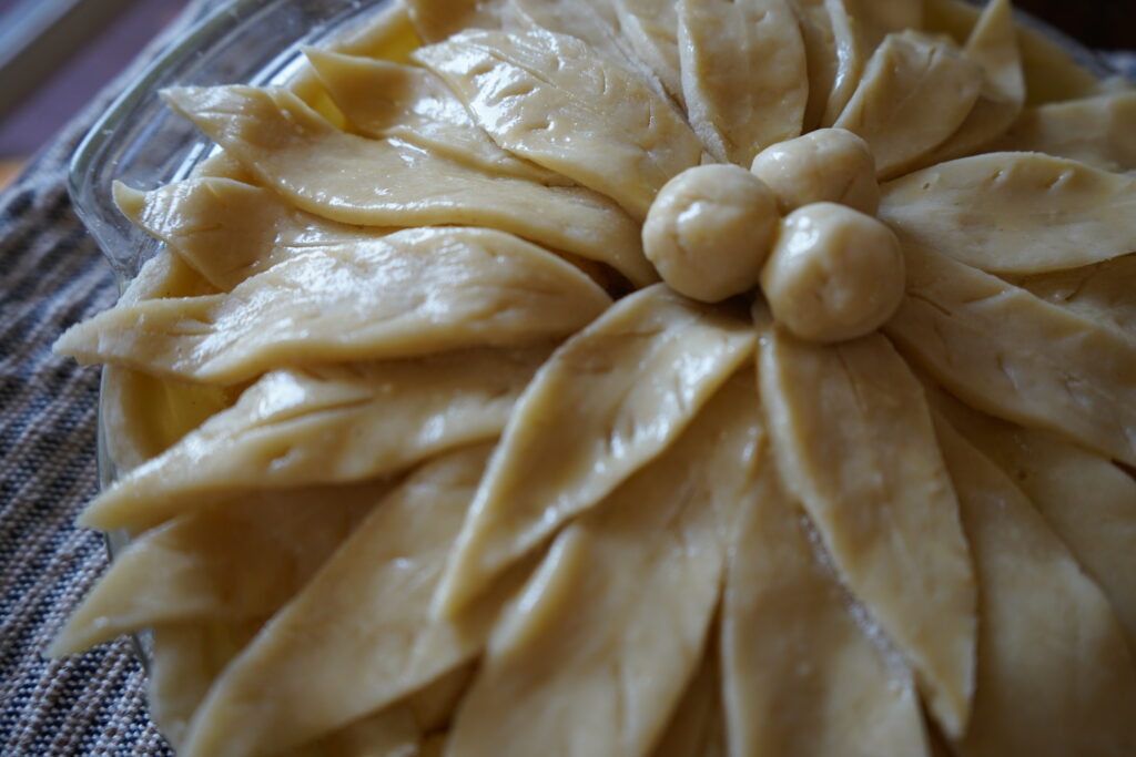 an apple pie with egg wash on the crust