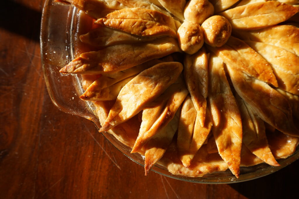 Flaky pie crust of a pie made with apples