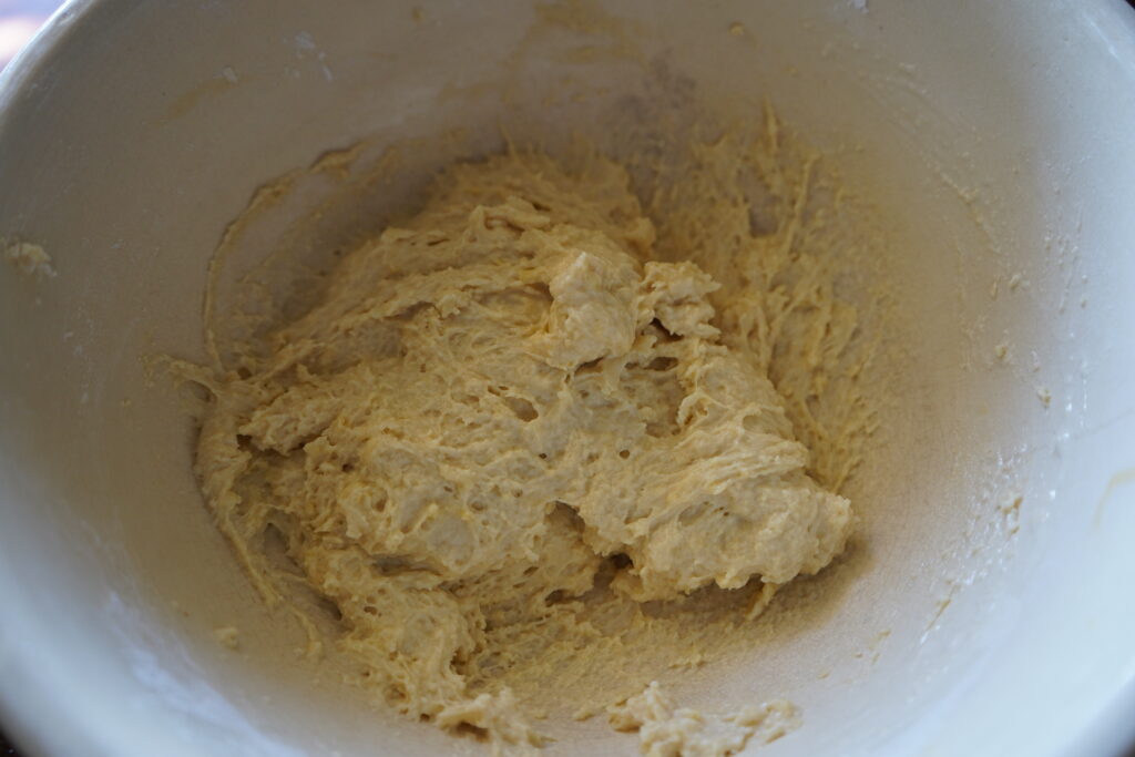 a pasty looking dough in a mixing bowl