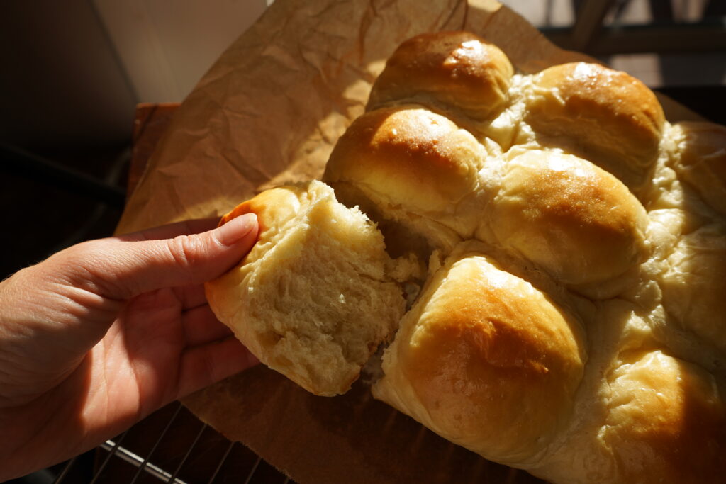 dinner rolls being pulled apart