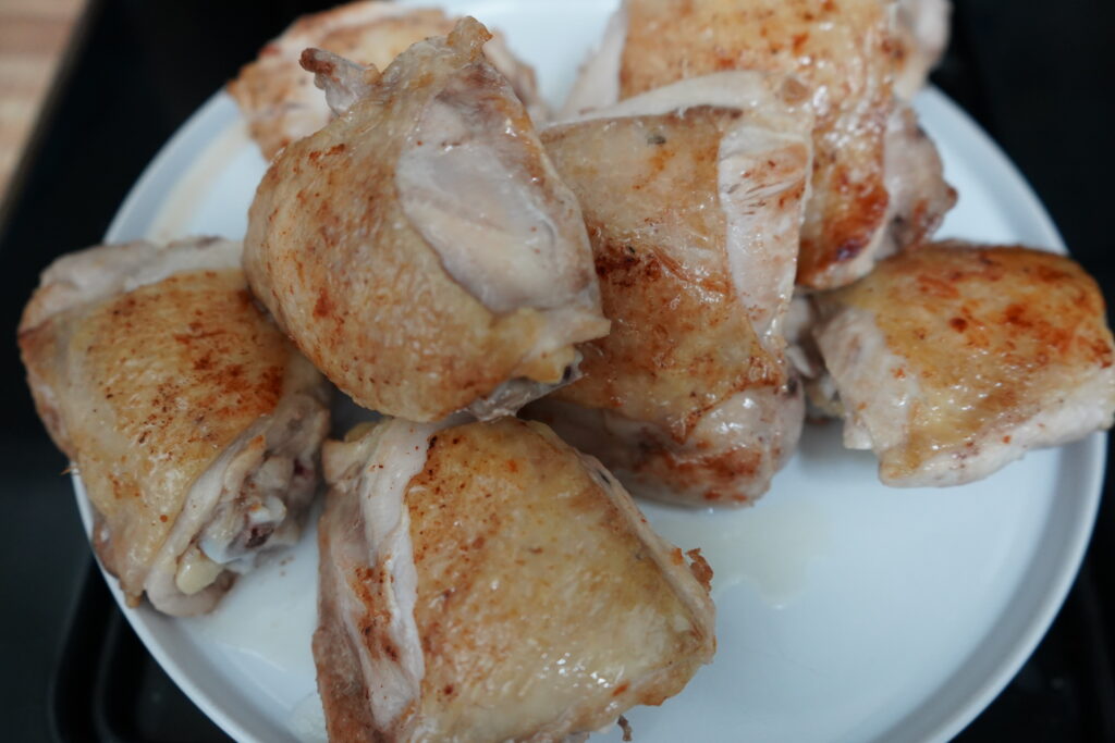 cooked chicken thighs on a plate