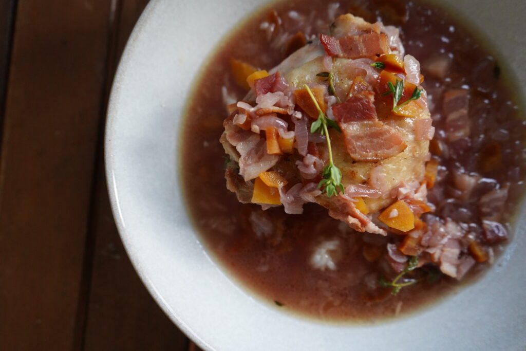 Coq Au Vin Blanc in a white dish