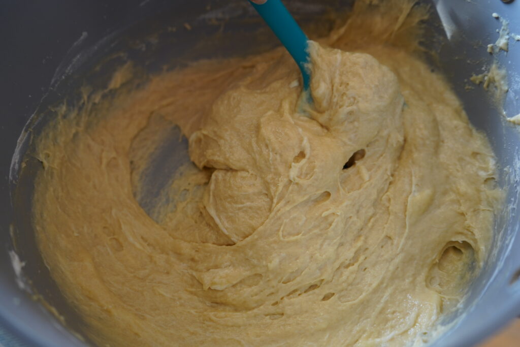 dough being stirred in a bowl