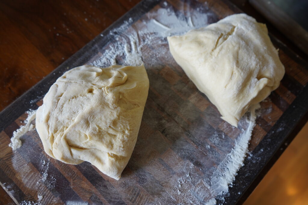 to pieces of dough n a cutting board