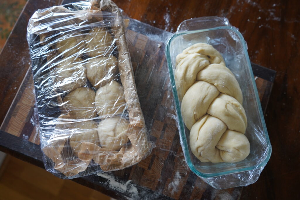 2 brioche loafs covered in plastic wrap