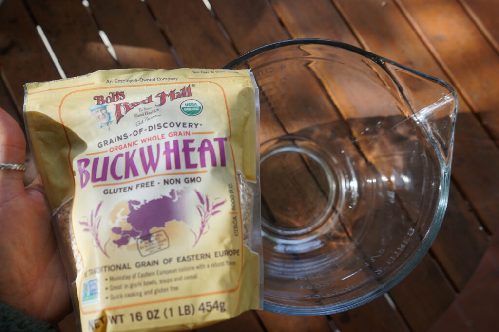 a bag of bob's red mill buckwheat over a glass mixing bowl