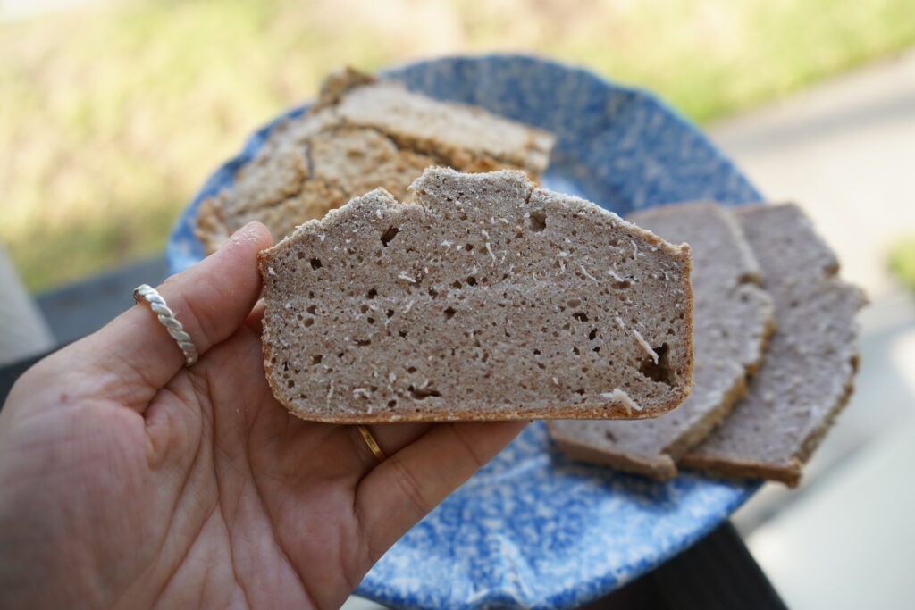 a slice of buckwheat being held by a hand