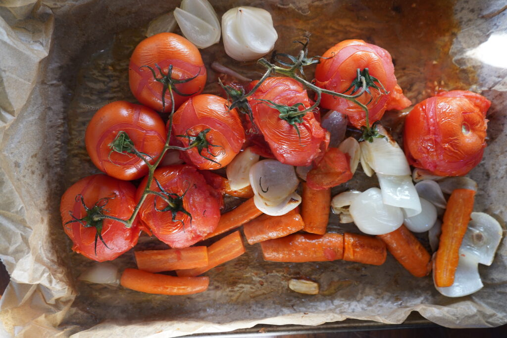 roasted tomatoes on a baking sheet