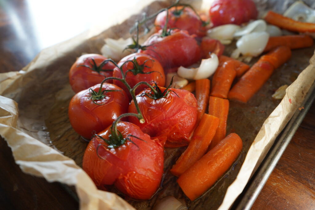 a baking sheet with roasted vegetables on it