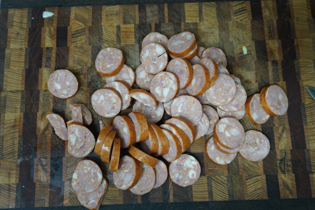 slices of smoked sausage on a cutting board