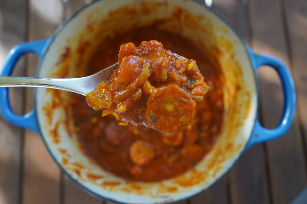 spoon pulling rougail out of a pot