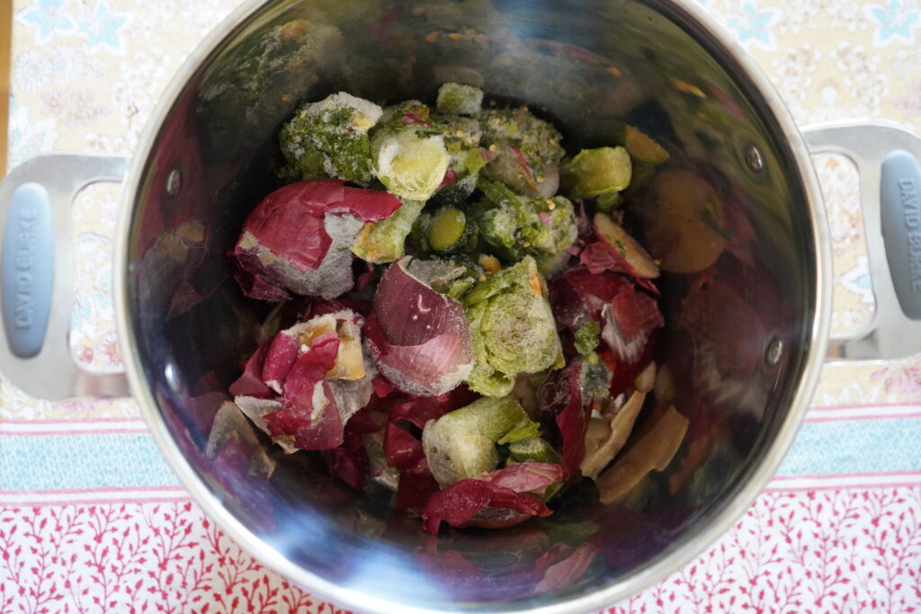 frozen vegetables in a stainless steel pot