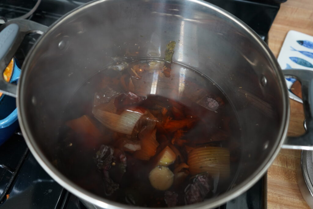 homemade broth in a stainless steel pot