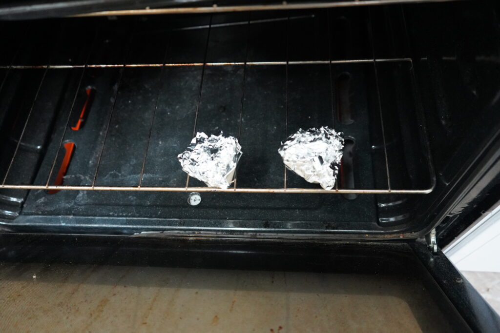 two lumps of foil in the oven