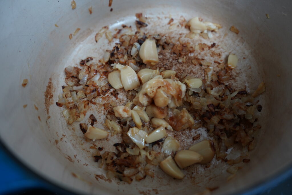 roasted garlic added to a dutch oven of sauteed onions