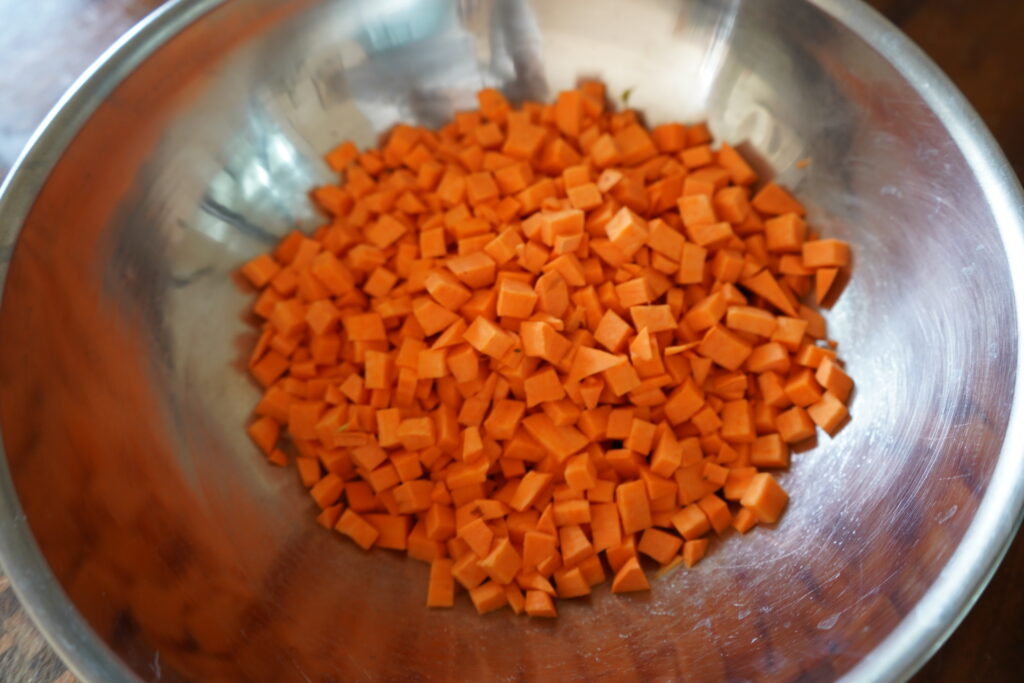 small cubed sweet potato in a metal bowl