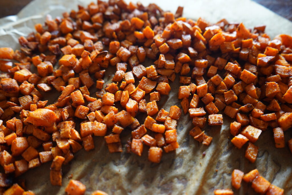 small cubed sweet potato on parchment paper