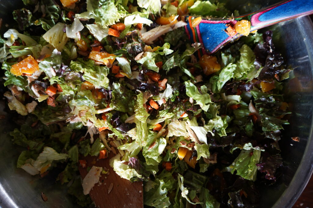 a salad in a mixing bowl