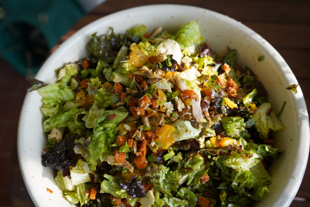 a fully loaded salad in a big bowl