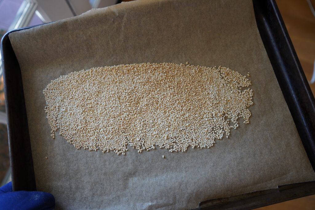 toasted sesame seeds on a baking dish