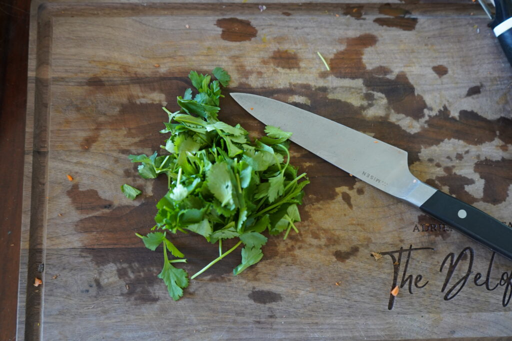 chopped cilantro on a cutting board