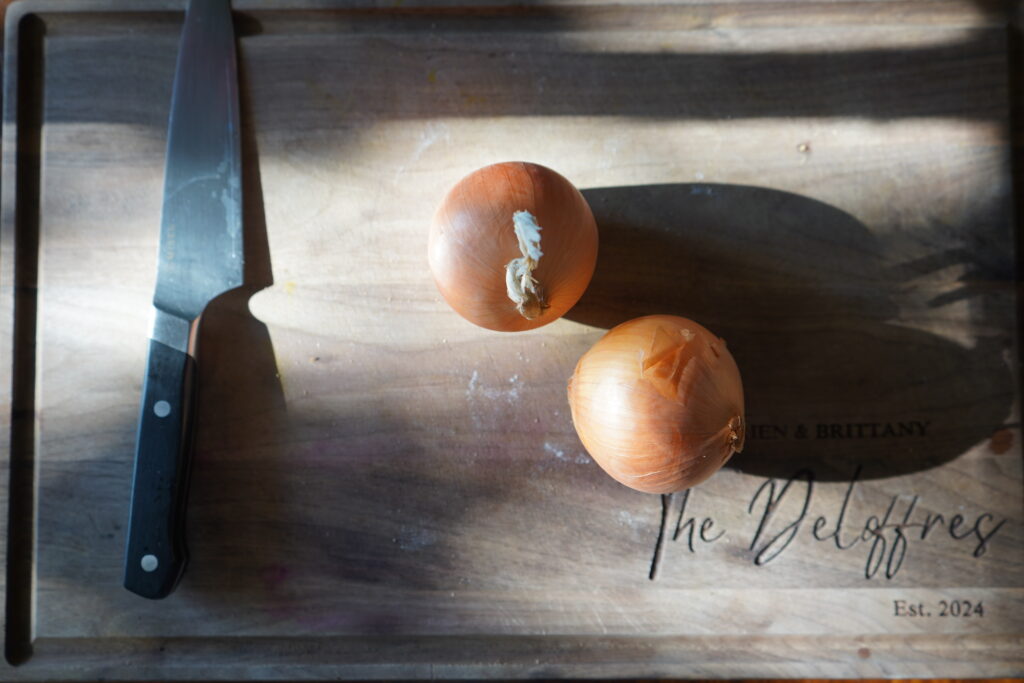 two onions on a cutting board