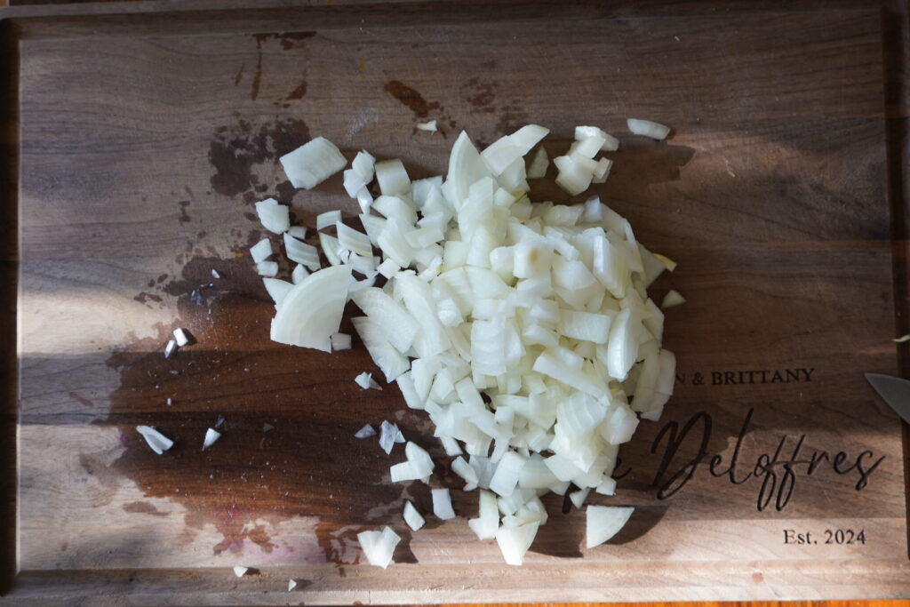 chopped onion on a cutting board