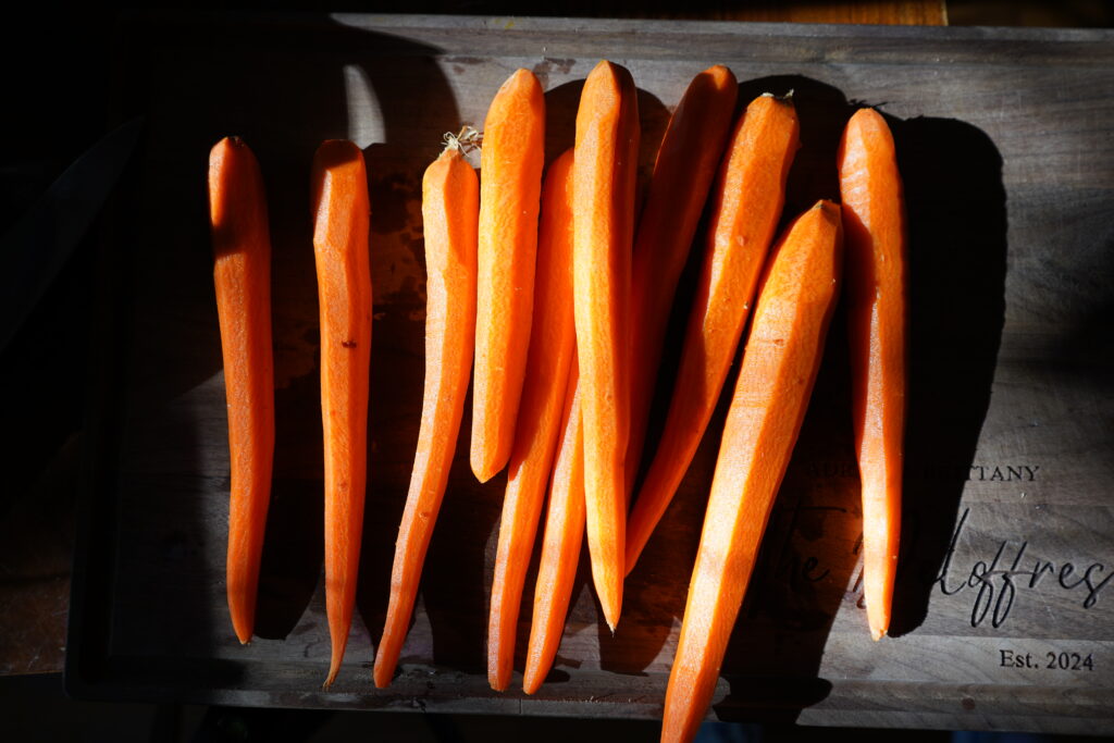 shaved carrots on a cutting board