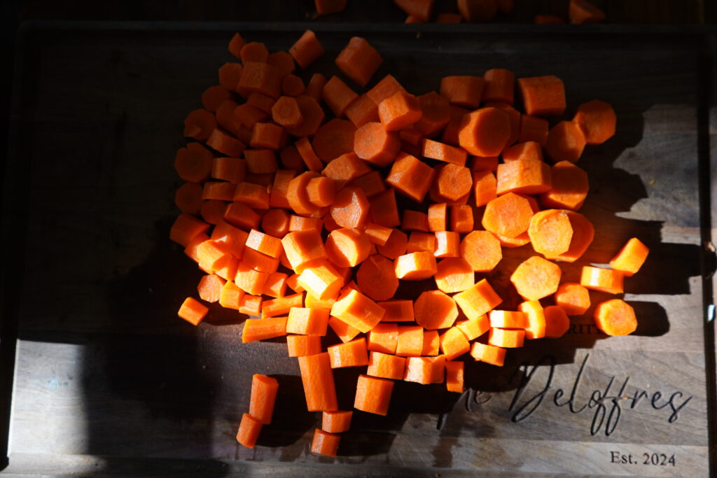 largely chopped carrots on a cutting board